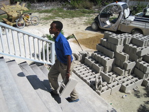 Ocean Academy student carries blocks upstairs