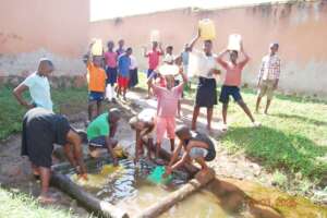 school children looking for water miles away.