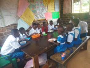 school children having a meal at school