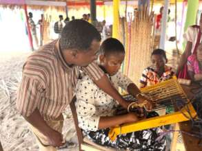Visually impaired John teaches door mat weaving