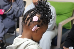 Unathi shows her device