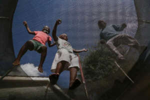 Children playing on trampolines in Nyumbani