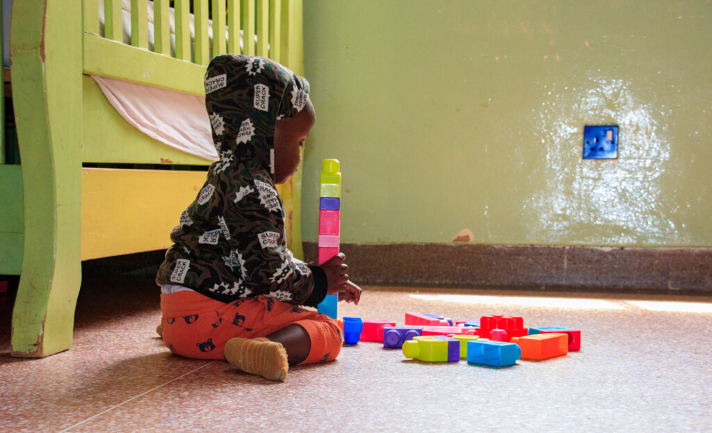 Baby hope playing at Nyumbani Respite Care Center.