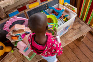 Maria plays at Nyumbani  Respite Care Center