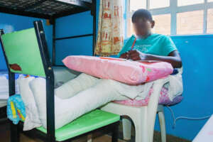 Joel studying at Nyumbani Children's Home