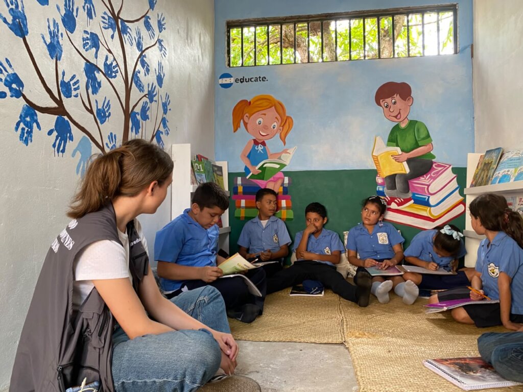 educate. volunteer Anika leading a reading circle
