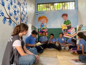 educate. volunteer Anika leading a reading circle
