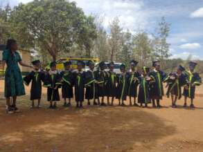 Staff Guides Learners During Graduation
