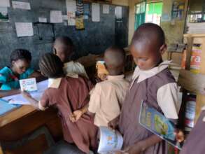 Learners pick books from the school library