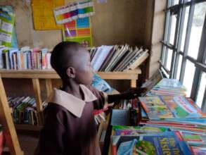 A learner choosing a book to read