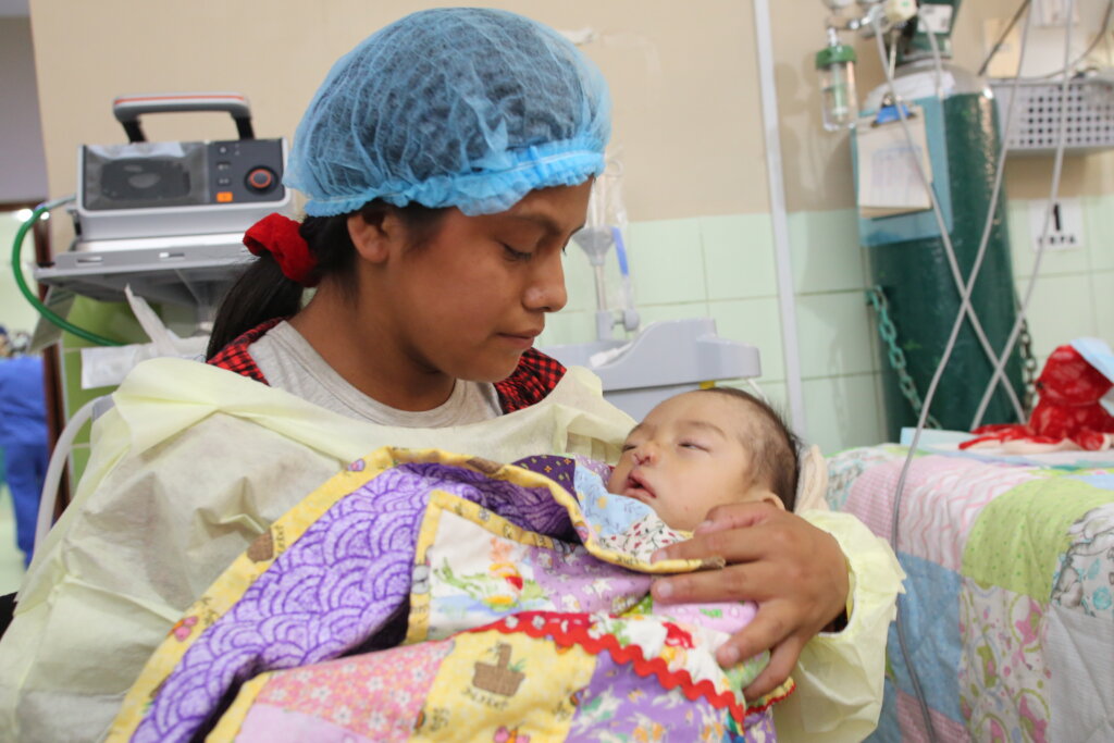 Mother with child post-surgery