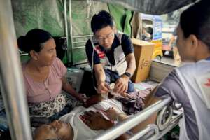 Dr. Inaba treats a patient at the field clinic