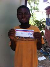 Omel smiling big with his birth certificate!
