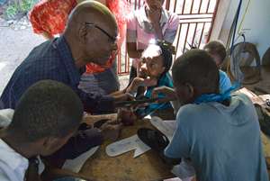 Zaka teaching his fellow artisans.