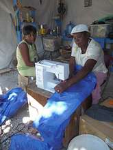 Sewing bags to fill with crushed rubble.