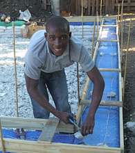 Construction of the recycled straw bale house.