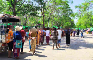 Survivors form a long line at a distribution point