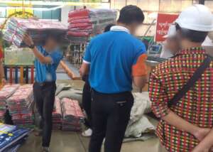 Partner organization staff procuring supplies