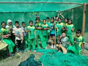 Children help preparing the plant nursery.