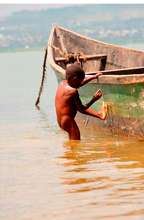A child gets out of the lake
