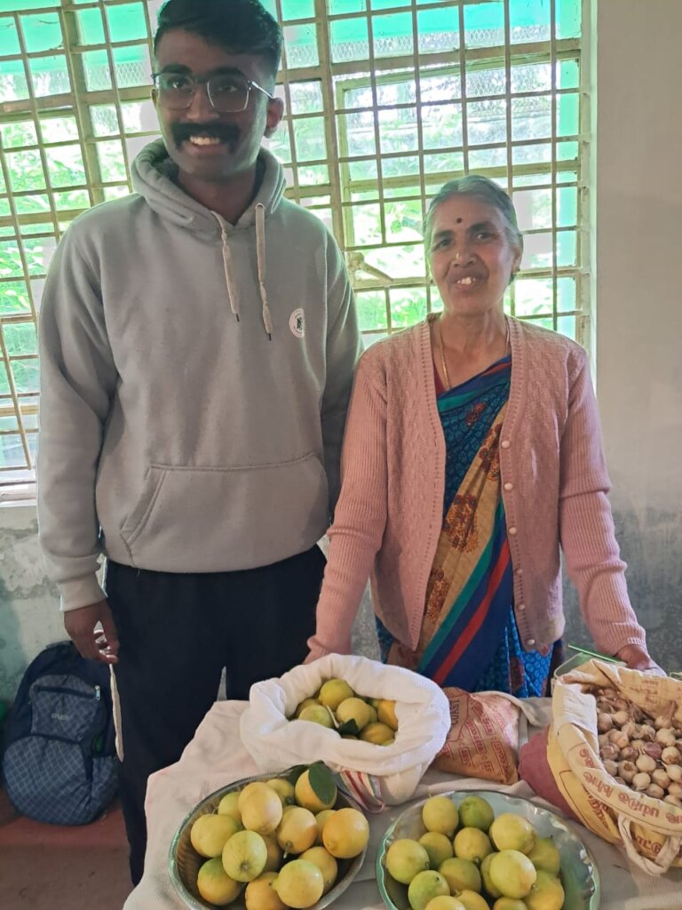 Latha a Senior farmer mentoring a young farmer