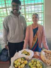 Latha a Senior farmer mentoring a young farmer