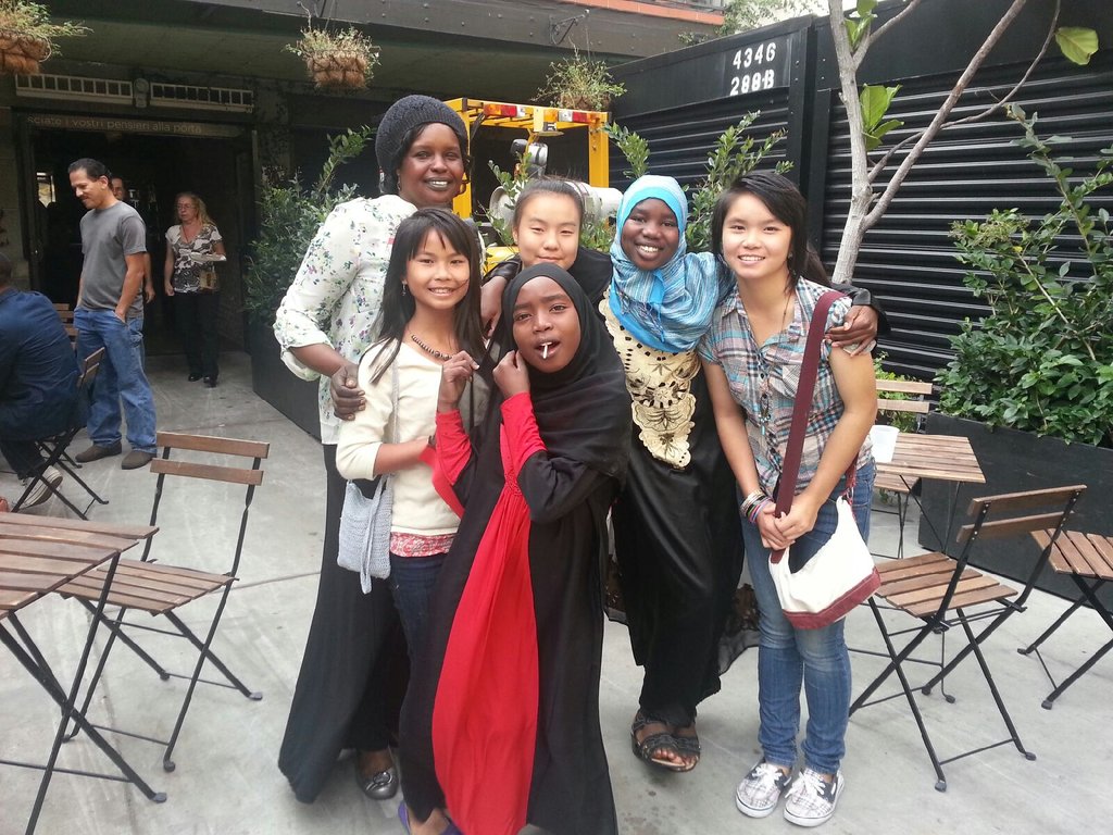 Staff with Darfuri and Karen tutoring students