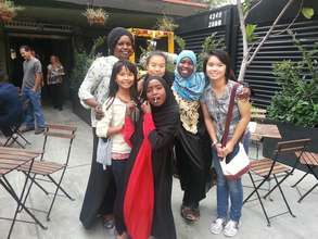 Staff with Darfuri and Karen tutoring students