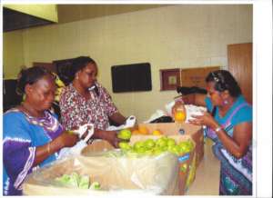 Staff (center) taking call from refugee