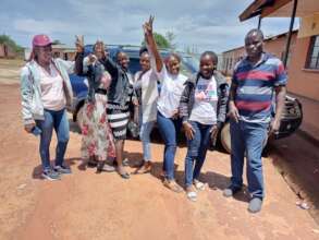 Scholarship Graduates with the Director