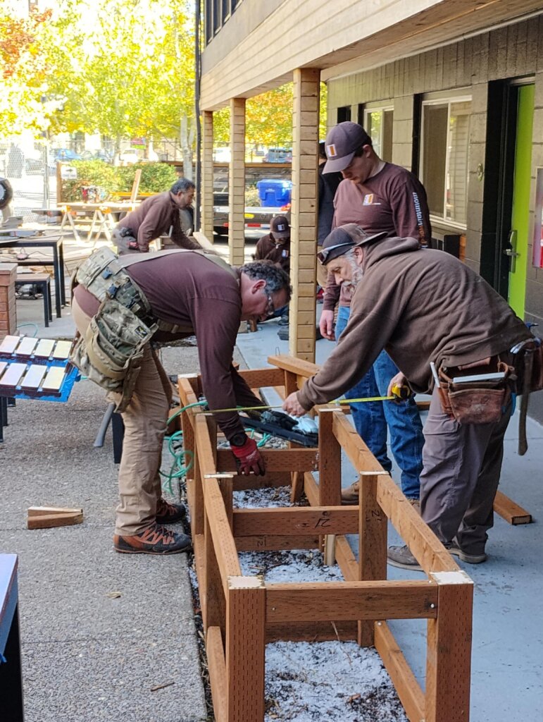 Volunteers beautify patio for Veteran shelter