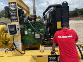 FRF Volunteer fueling equipment at the river.