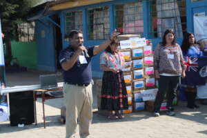 Colonia Molina receiving CoEd textbooks in 2016