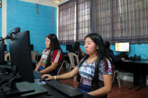Two students in a typical CoEd Computer Center