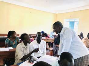 Trainer Emmanuel Bida interacts at Union Primary