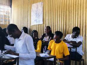 Participants take notes at Baraka Central Primary