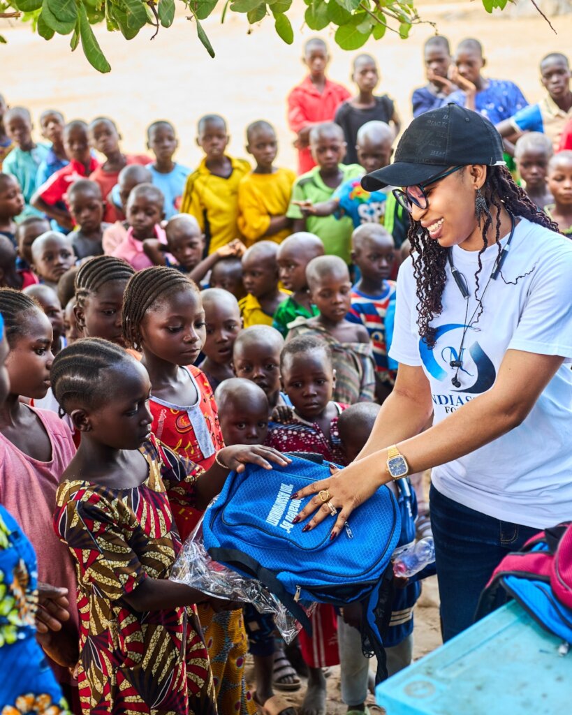 Students receiving their school uniform and bag