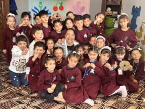Founder Nakano and students in the kindergarten