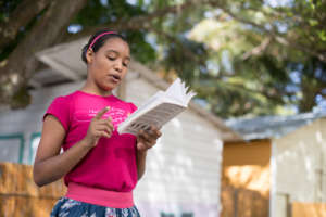 Erika, age 15, reads aloud during book club