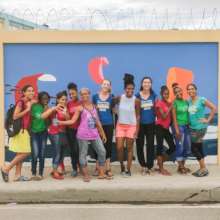 Artist Xavier Ringer with Mariposas & Volunteers