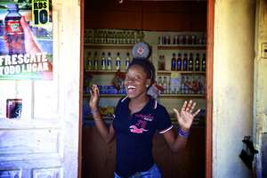 Ana Iris at the colmado purchasing supplies!