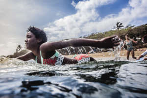 Paddling out (photo by Jianca Lazarus)