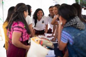Students visit the Pueblo a Pueblo booth