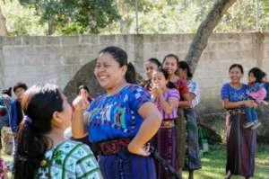Rebeca leads an activity at the end-of-year party