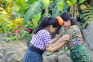 Participating mothers play a game