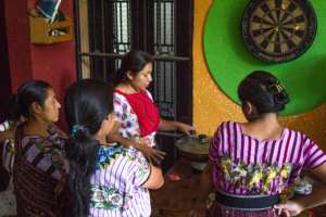 Mothers learning how to cook with new veggies