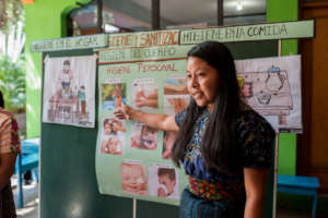 Rebeca leading a workshop with the women