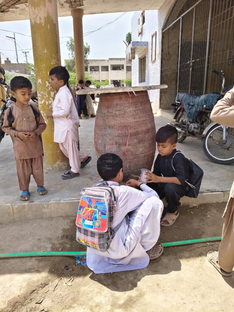 Students are drinking water from container