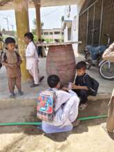 Students are drinking water from container
