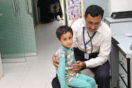 Child being examined - Baldia Town, 2014